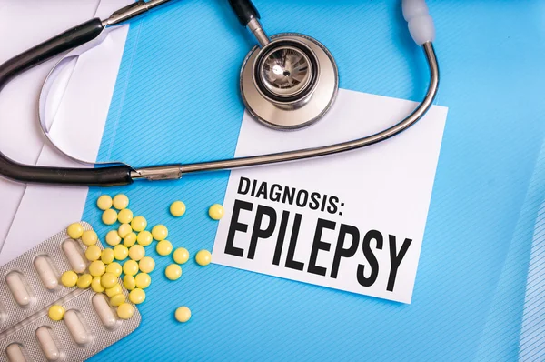 Epilepsy word written on medical blue folder with patient files
