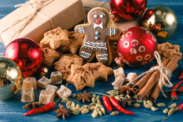 Gingerbread Man over Wood. Christmas Holiday Background.
