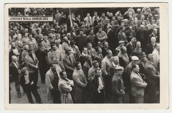 Vintage photo shows people celebrate May Day (International Workers\' Day). Retro black & white  photography.