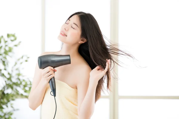 Asian beauty woman hair dryer to drying hair after shower