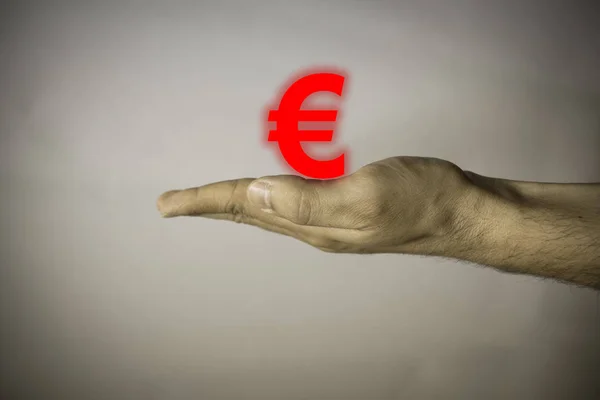 Human hand on vintage background with euro symbol