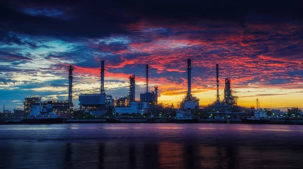 Oil refinery industry plant along twilight morning.