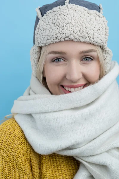 Woman in a woolly winter hat with earflaps