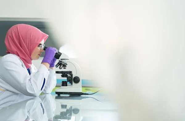 Muslim lab worker with hijab