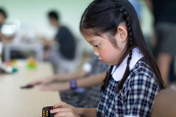 Child Playing Domino Game