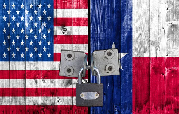 US and Texas flag on door with padlock
