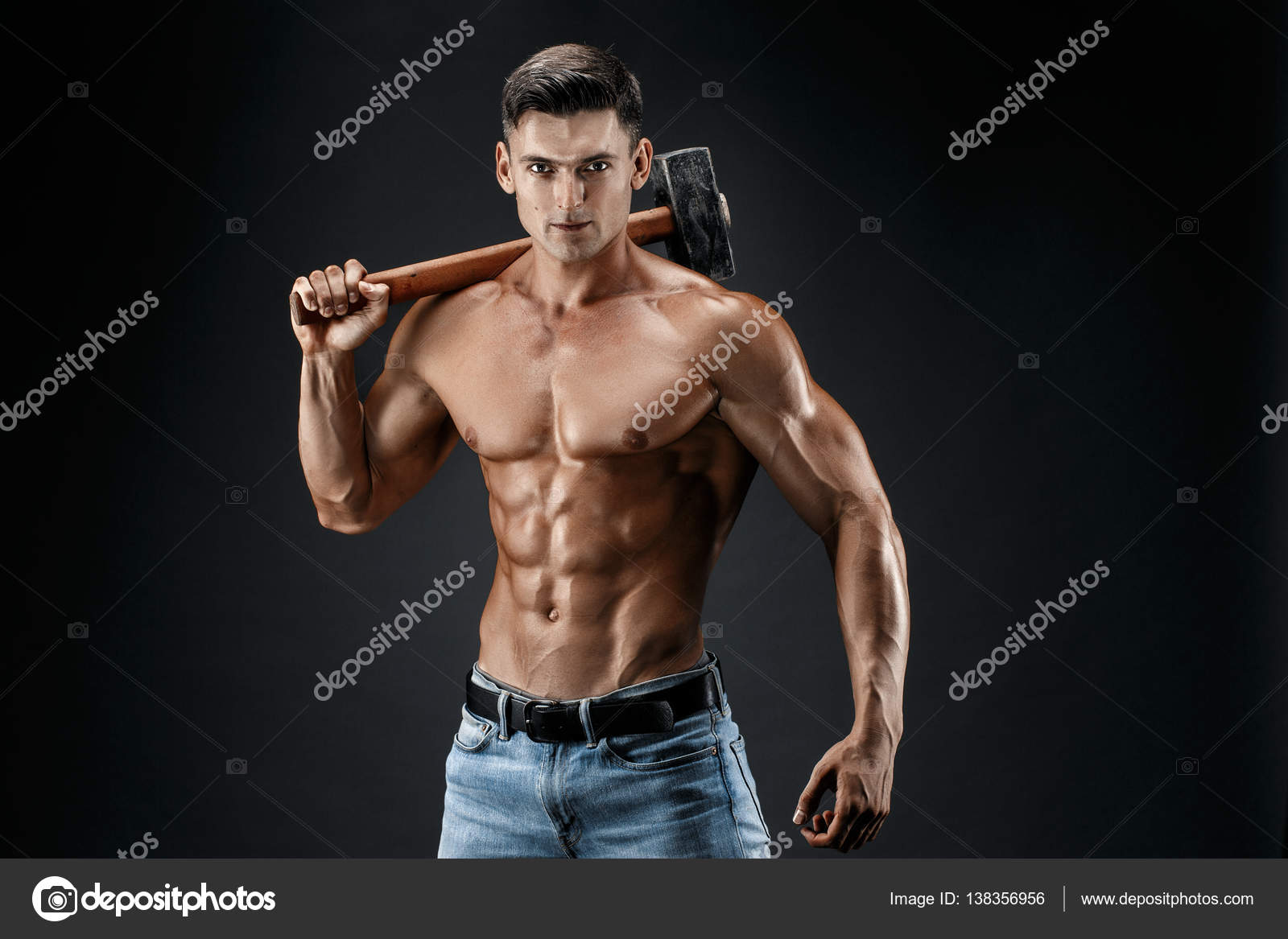 Muscular Man With Naked Torso Holding Big Hummer Isolated On Dark Grey