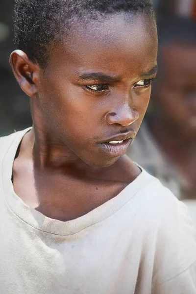 Africa, Tanzania, Zanzibar - February 2016: The boy sells fruit in the market