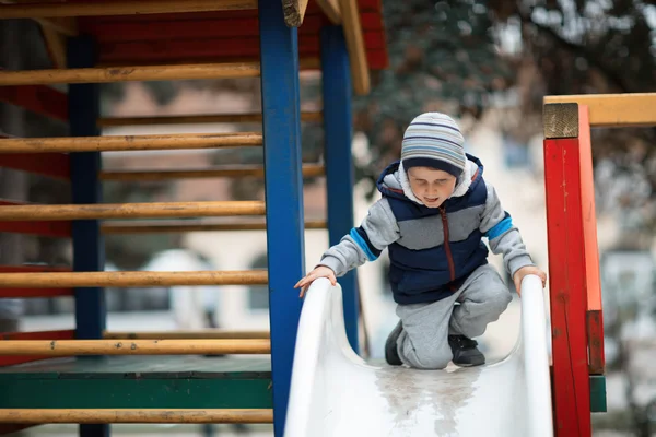 Child climbing the slide
