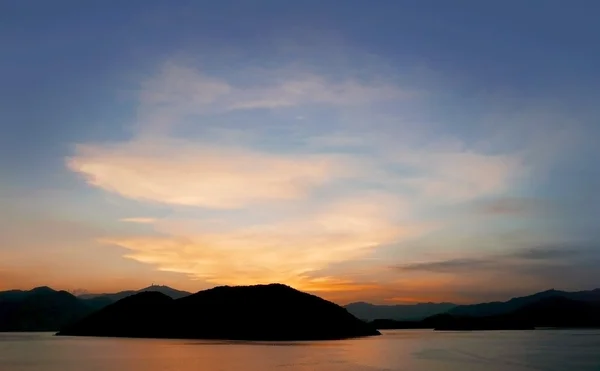 Mountain, ocean, cloud and gradient sky at sunset