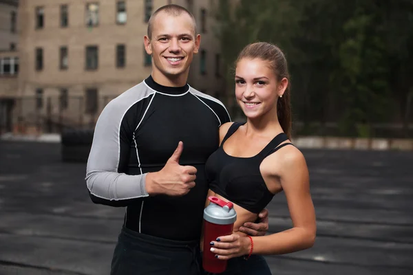 Athlete muscular sportsmen man and woman young couple Crossfit fitness sport training lifestyle bodybuilding concept