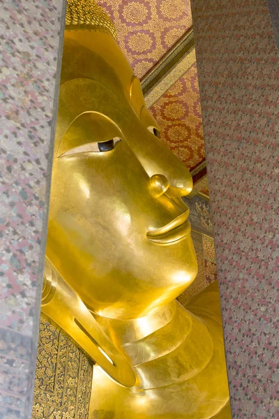 The face of reclining Buddha statute in the temple