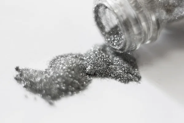 Silver sequins. a scattering of silver glitter texture and backg