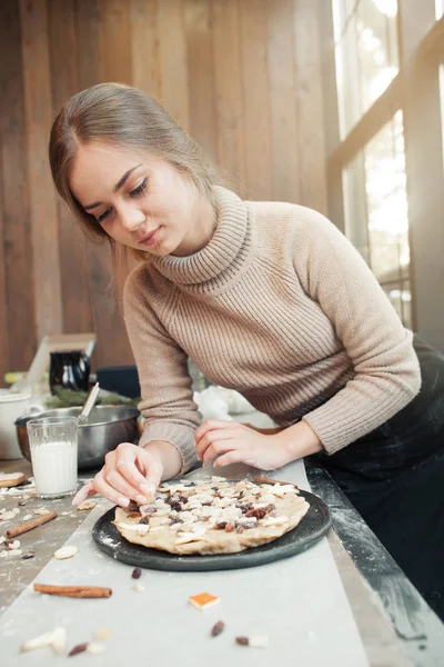 Woman preparing pie with love