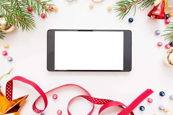 Smartphone with blank screen in Christmas frame