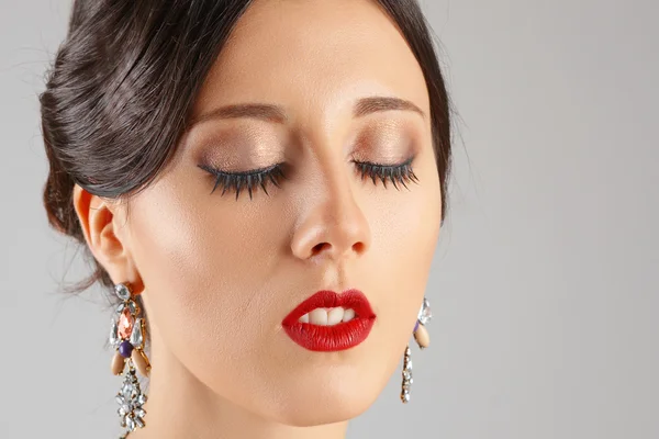 Face of beautiful young woman with closed eyes and red lips. Bea