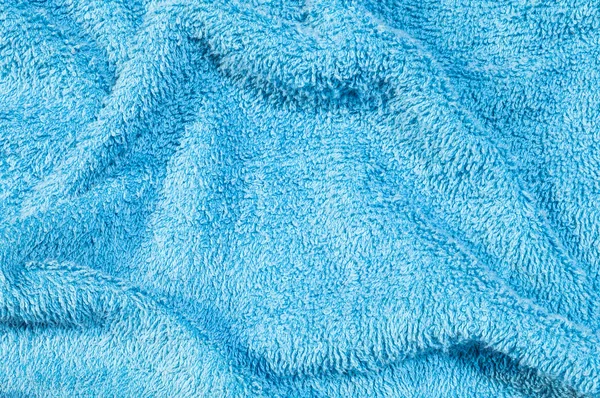 Closeup surface fabric pattern at old and wrinkled blue fabric towel texture background