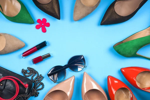 Women accessories and shoes on light background. Top view.