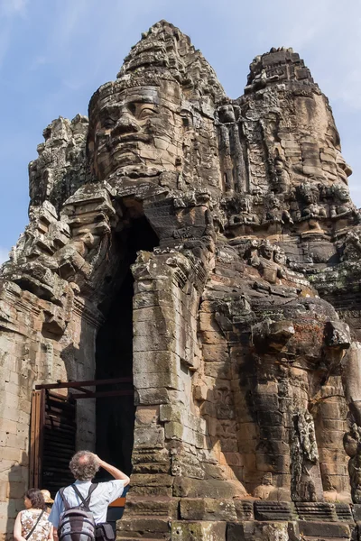 Tourists near South Gate of Angkor Thom from outside the city. UNESCO World Heritage Site.