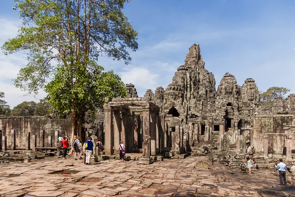 Tourists in Angkor Thom. Angkor Wat, Siem Reap, Cambodia. UNESCO World Heritage Site.