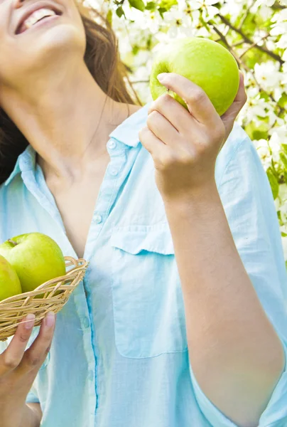 Beautiful woman holding apples