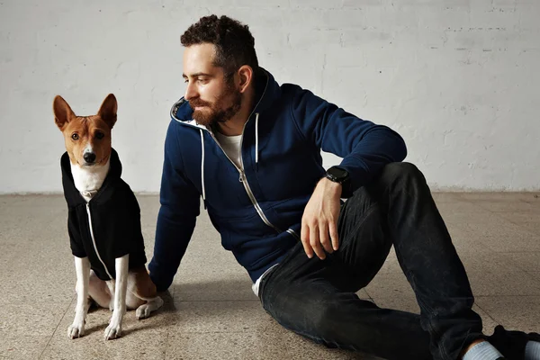 Dog and owner wearing matching outfits