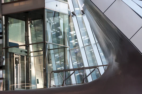 Glass elevator shaft in a modern building