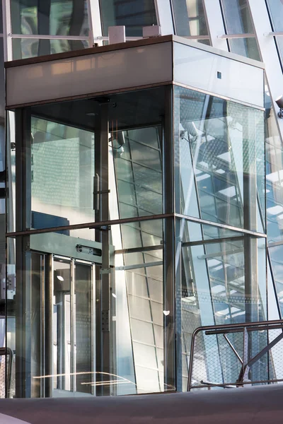 Glass elevator shaft in a modern building