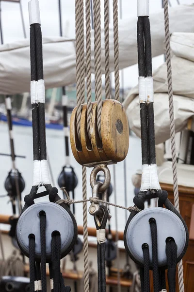 Old wooden pulley on a sailing boat