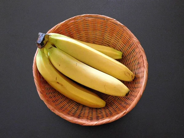 Bananas to eat on a black background