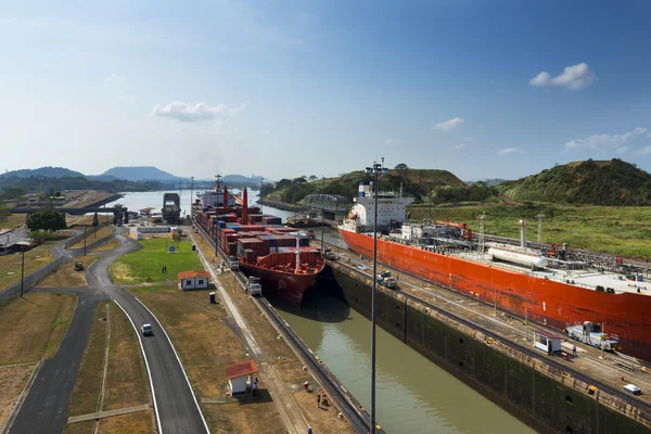 Cargo ship and a oil tanker in the Miraflores Locks in the Panama Canal, in Panama