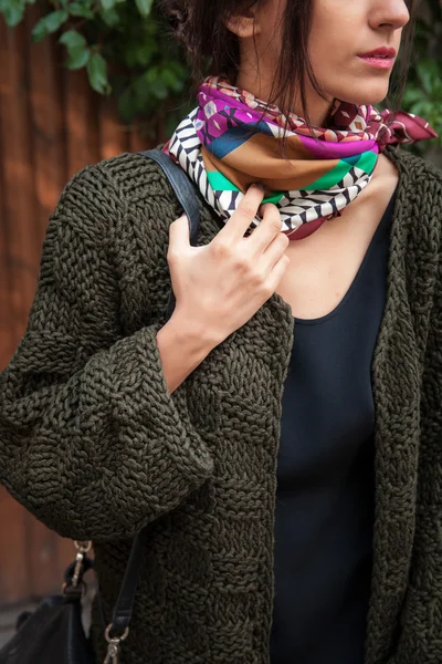 Streetstyle woman wearing colorful knitted coat