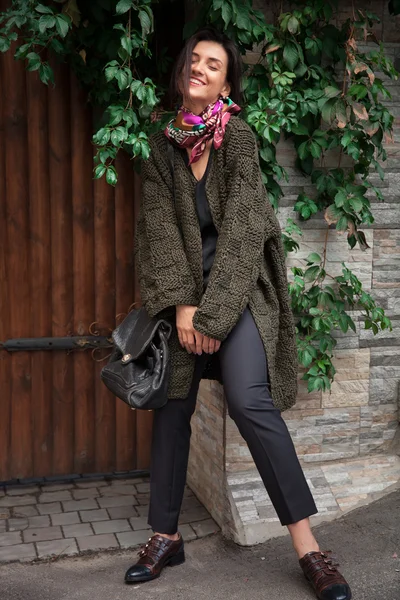 Streetstyle woman wearing colorful knitted coat