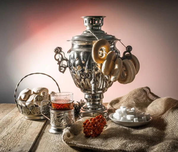 Russian samovar, tea holder, viburnum, cake