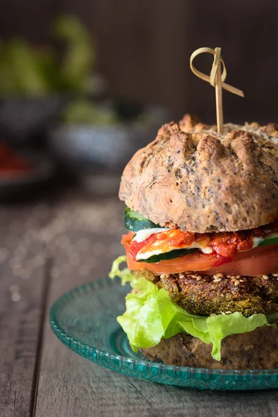 Close up of veggie burger with homemade olive bread