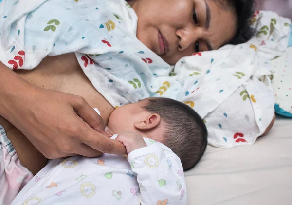 Breastfeeding Concept,mother lying breastfeeding newborn baby