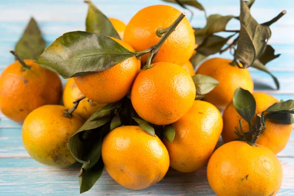 Fresh juicy tangerines with leaves