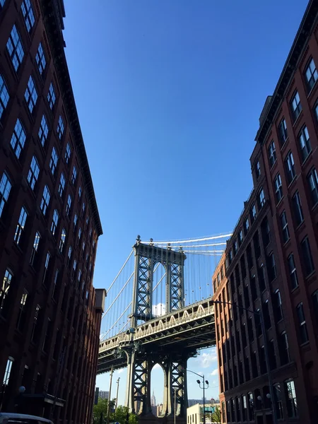 Manhattan bridge at the middle of silhouette buildings