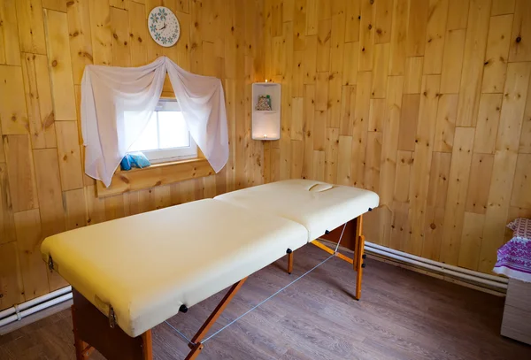 Massage cabinet.  couches and candles. The house is made of natural timber. Warm  cozy atmosphere.