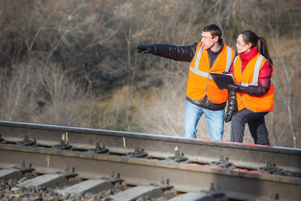 Railroad workers maintaing railways