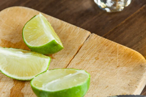 Tequila Shots With Close Up Lime Wedges Cut Up For Drinking At A Party