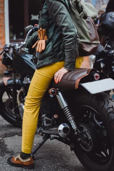 Woman sitting on bike