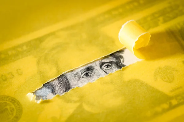 Peeking Through Torn Yellow Paper