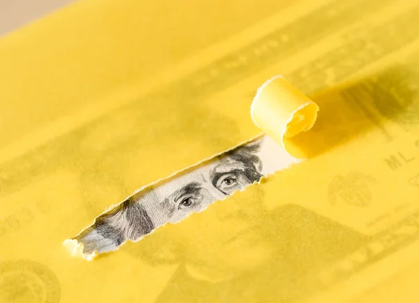 Peeking Through Torn Yellow Paper