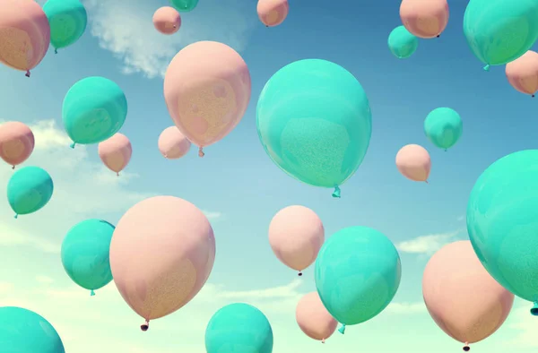 Colorful blue and pink balloons floating in summer holidays in pastel color filter, concept of summer, holidays, and joyful