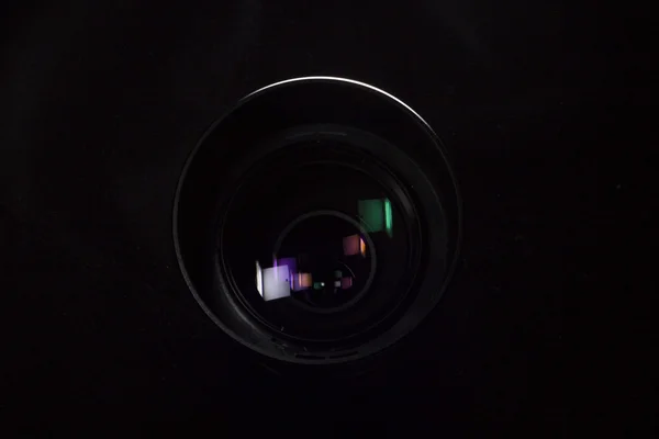 Telephoto lens aperture close up concept. Dark silhouete photo.