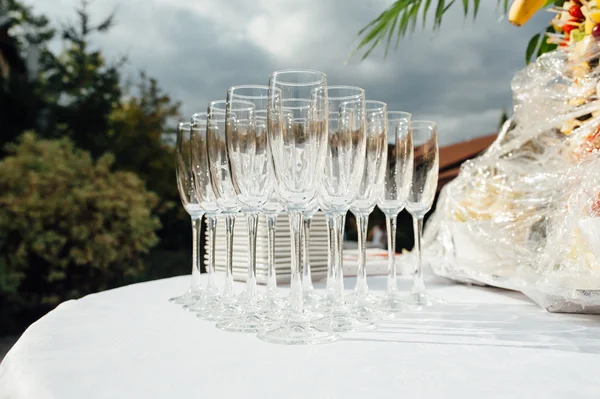 Wedding glasses filled with champagne at banquet