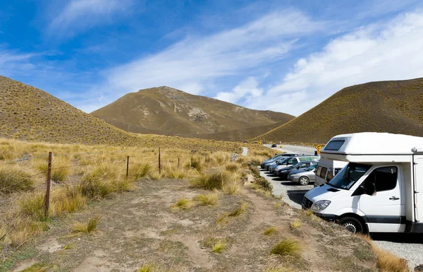 Otago, New Zealand - February 2016: Car park at scenic lookout of Lindis Pass on State Highway 8 (Tarras - Omarama - Lindis Pass Road), lies between the valleys of the Lindis and Ahuriri Rivers, south island of New Zealand.