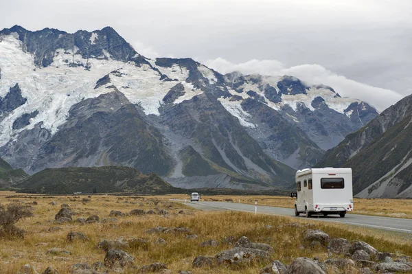 Mount Cook, New Zealand - February 2016: Motorhome on Mount Cook Road (State Highway 80) along the Tasman River leading to Aoraki / Mount Cook National Park and the village