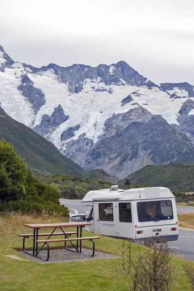 Mount Cook Village, New Zealand - February 2016: Motorhome parking on the road in Mount Cook Village located within New Zealand\'s Aoraki / Mount Cook National Park